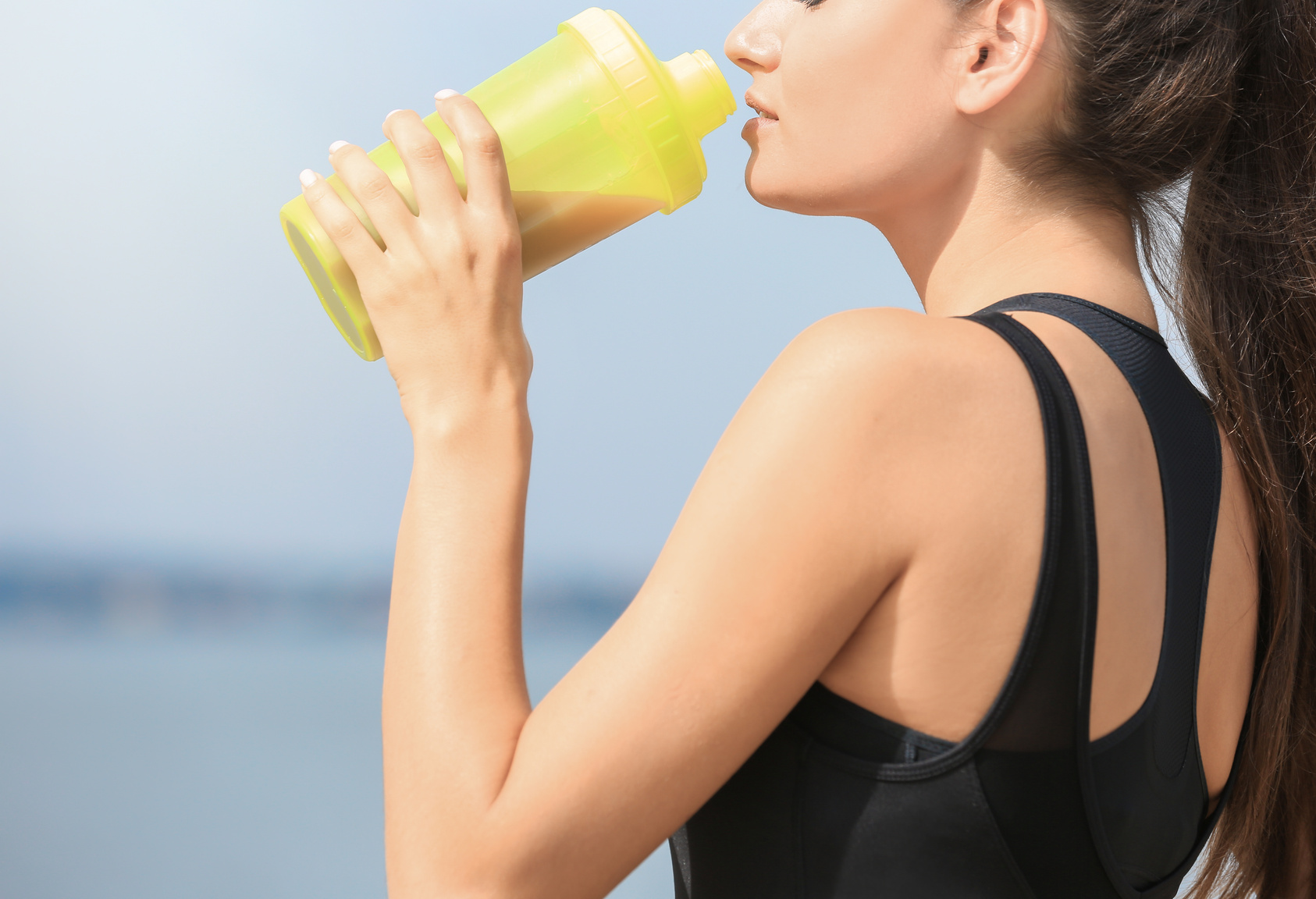 Young Woman Drinking Protein Shake